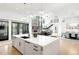 Open floor plan featuring a bright kitchen, modern living area, and dining space at 2821 E Cedar Ave # 2, Denver, CO 80209
