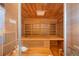 Inviting wooden sauna features multi-tiered seating and a glass door for a relaxing spa-like experience at 2821 E Cedar Ave # 2, Denver, CO 80209