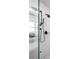 Modern shower featuring matte black fixtures and white subway tile at 2821 E Cedar Ave # 2, Denver, CO 80209