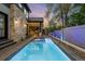 Outdoor pool and spa area with stone accents, with a backdrop of a colorful sunset at 2821 E Cedar Ave # 2, Denver, CO 80209