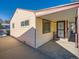 Side view of the house showcasing the carport and entryway at 2611 S Knox Ct, Denver, CO 80219