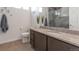 Well-lit bathroom with granite countertops, modern fixtures, and decorative wall art at 16841 Askins Loop # 101, Parker, CO 80134