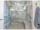 Modern bathroom featuring a spacious glass-enclosed shower with a built-in bench and elegant tile work at 16841 Askins Loop # 101, Parker, CO 80134