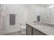 Neutrally decorated bathroom with a stone vanity, toilet, decorative shower curtain, and tile floors at 16841 Askins Loop # 101, Parker, CO 80134