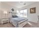 Bright bedroom with a stylish bed frame, neutral decor, and a large window with natural light at 16841 Askins Loop # 101, Parker, CO 80134