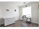 Bright room with wood floors, a desk, and a white cabinet at 16841 Askins Loop # 101, Parker, CO 80134