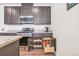 Kitchen features stainless steel appliances, granite countertops, and ample storage with pull-out drawers at 16841 Askins Loop # 101, Parker, CO 80134