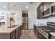 Well-equipped kitchen with stainless steel appliances, granite countertops, and ample cabinet space at 16841 Askins Loop # 101, Parker, CO 80134