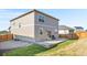 The backyard features a concrete patio, ideal for outdoor entertaining and grilling at 4125 Marble Dr, Longmont, CO 80504