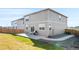 The backyard includes a concrete patio, a grill, and a fenced yard, perfect for outdoor living at 4125 Marble Dr, Longmont, CO 80504