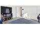 Neutral bedroom with entertainment center and television with gray carpet floors at 4125 Marble Dr, Longmont, CO 80504
