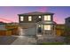 Charming two-story home featuring stone accents, a covered front porch, and a well-maintained landscaped yard at 4125 Marble Dr, Longmont, CO 80504