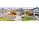 Two-story home featuring a two-car garage, landscaped front yard, and a cozy porch at 4125 Marble Dr, Longmont, CO 80504