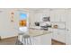 Modern kitchen featuring stainless appliances, granite countertops, subway tile backsplash, and white cabinets at 4125 Marble Dr, Longmont, CO 80504
