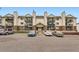 Spacious condo building featuring private balconies, brick accents and ample parking at 481 S Kalispell Way # 205, Aurora, CO 80017