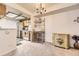 Open view from dining area into kitchen with white appliances and wood cabinetry at 481 S Kalispell Way # 205, Aurora, CO 80017