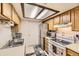 Cozy kitchen features stainless steel refrigerator and ample cabinet space at 481 S Kalispell Way # 205, Aurora, CO 80017