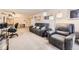 Open living room with a reclining sofa, modern lighting, and comfortable seating arrangements at 481 S Kalispell Way # 205, Aurora, CO 80017