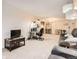 Spacious living area featuring a sofa, a work station, and modern decor at 481 S Kalispell Way # 205, Aurora, CO 80017