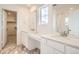 Bathroom with double vanity, walk-in shower, and marble flooring at 39621 Congress Ln, Elizabeth, CO 80107