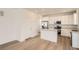 Modern kitchen with white cabinets, stainless steel appliances, and an island at 39621 Congress Ln, Elizabeth, CO 80107