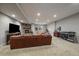 Finished basement offers a stone fireplace, comfortable seating, and dedicated fitness space at 5069 Castle Pines S Dr, Castle Rock, CO 80108