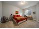 Comfortable bedroom featuring carpet, natural light, and cozy furniture at 5069 Castle Pines S Dr, Castle Rock, CO 80108
