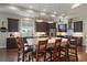 Spacious kitchen island with seating and modern pendant lighting, offering a perfect blend of style and functionality at 5069 Castle Pines S Dr, Castle Rock, CO 80108