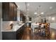 Stylish kitchen with an island, modern appliances, and pendant lighting at 5069 Castle Pines S Dr, Castle Rock, CO 80108