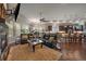 Open concept living room with a fireplace and seamless access to the kitchen at 5069 Castle Pines S Dr, Castle Rock, CO 80108