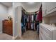Spacious walk-in closet with custom shelving and ample storage for clothing and accessories at 5069 Castle Pines S Dr, Castle Rock, CO 80108