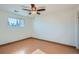 Bright bedroom with hardwood floors, a ceiling fan, and a window offering natural light at 16259 W 10Th Ave # J5, Golden, CO 80401