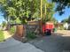Detached garage with alley access, wooden fence, and landscaping at 292 S Lafayette St, Denver, CO 80209