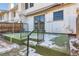 Artificial turf backyard with steps and metal railing at 10330 E Jewell Ave # 67, Aurora, CO 80247