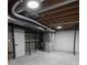 Unfinished basement with exposed beams and utilities, ready for customization at 10330 E Jewell Ave # 67, Aurora, CO 80247