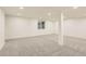 Bright and airy finished basement with large window and carpet at 10330 E Jewell Ave # 67, Aurora, CO 80247