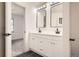 Bright bathroom with double vanity and black accents at 10330 E Jewell Ave # 67, Aurora, CO 80247