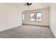 Bright bedroom with ceiling fan and neutral carpeting at 10330 E Jewell Ave # 67, Aurora, CO 80247