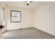 Well-lit bedroom with neutral carpeting and window at 10330 E Jewell Ave # 67, Aurora, CO 80247