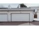 Attached garage with a white door and house number 67 at 10330 E Jewell Ave # 67, Aurora, CO 80247