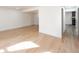 Spacious living room with light-colored hardwood floors, neutral paint and ample natural light at 10330 E Jewell Ave # 67, Aurora, CO 80247