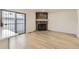 Bright living room features a brick fireplace and laminate flooring at 10330 E Jewell Ave # 67, Aurora, CO 80247