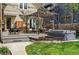 Backyard deck and hot tub with a fire pit and outdoor seating underneath a pergola at 1141 Adams St, Denver, CO 80206