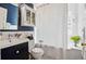 Charming bathroom with classic fixtures, a vanity, and tiled shower at 1141 Adams St, Denver, CO 80206