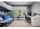 Cozy bedroom with a bunk bed, a desk, and ample natural light at 1141 Adams St, Denver, CO 80206