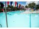 A vibrant community pool area, decorated with festive banners and surrounded by lifeguard stands at 1141 Adams St, Denver, CO 80206