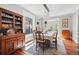 Elegant dining room with hardwood floors, a large window, and stylish lighting fixture at 1141 Adams St, Denver, CO 80206