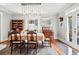 Bright dining room with hardwood floors, pendant lighting, and ample seating at 1141 Adams St, Denver, CO 80206