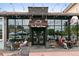 Exterior view of The French Press cafe with seating, awnings and large windows at 1141 Adams St, Denver, CO 80206