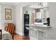 Bright kitchen with a breakfast bar seamlessly connects to the dining area at 1141 Adams St, Denver, CO 80206